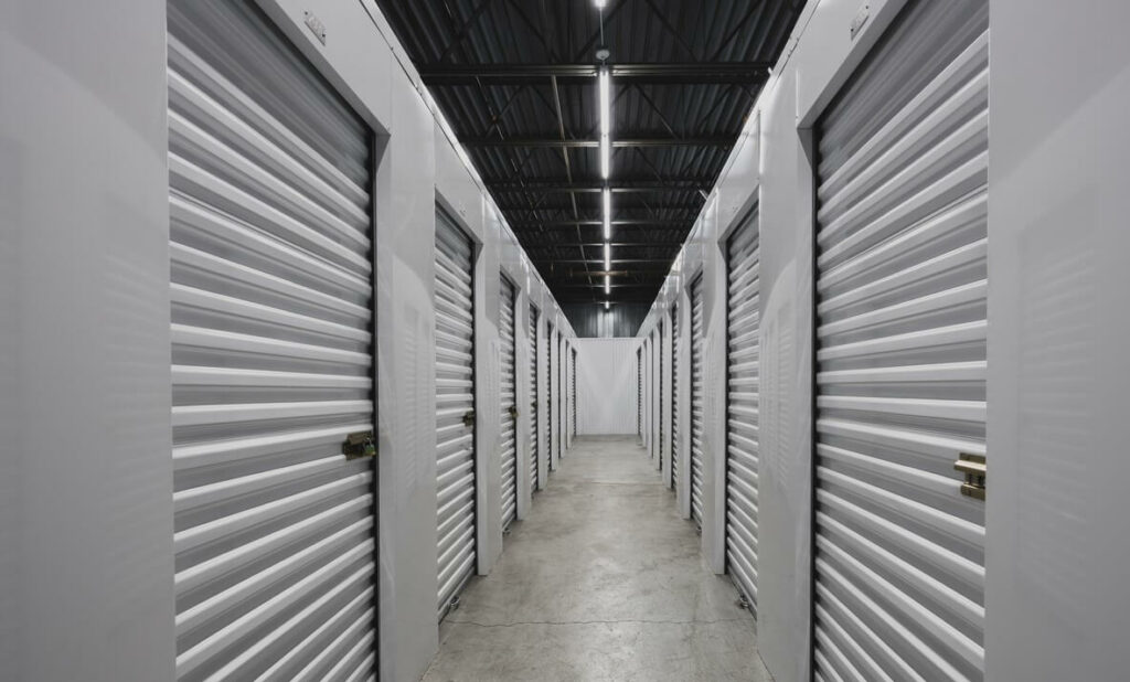 A hallway of climate-controlled storage units in a storage facility.