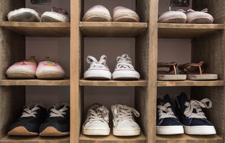 Close-up of a shoe organizer used in a hall closet.
